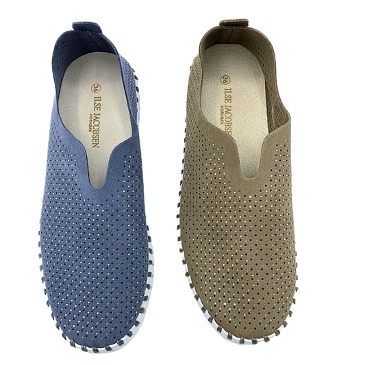 Top down view of a slip on sneaker with sparkles and tiny laser holes throughout the upper.  Shown in a blue/grey and a taupe color which they call Falcon.  Both have a white rubber sole.