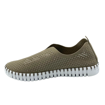 Inside view of slip on sneaker in a taupe color with crystals and cut outs throughout.  White rubber sole