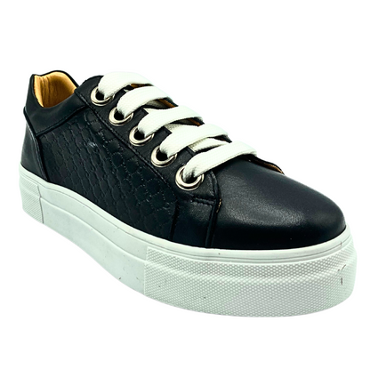 Angled side view of a sleek black leather sneaker with white laces and white outsole.  