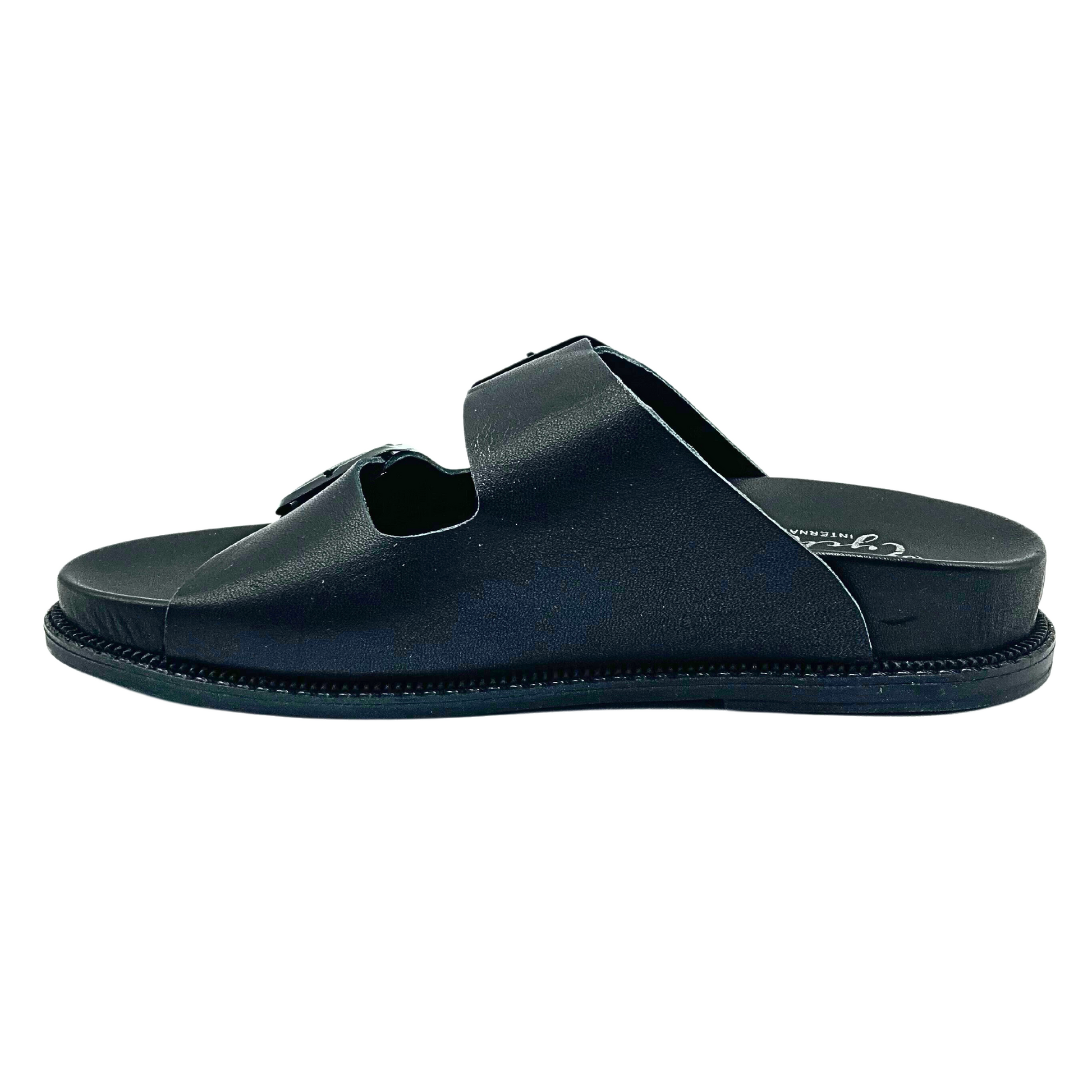 Inside view of black, slip on walking sandal.  Open toe and heel.  Erogonomic footbed