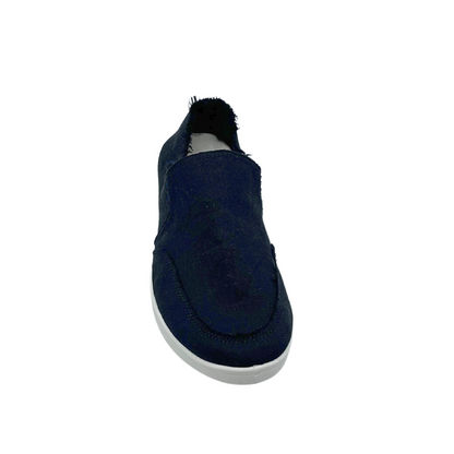 Top down view of black canvas slip on sneaker with ragged edged heel and white rubber sole.  