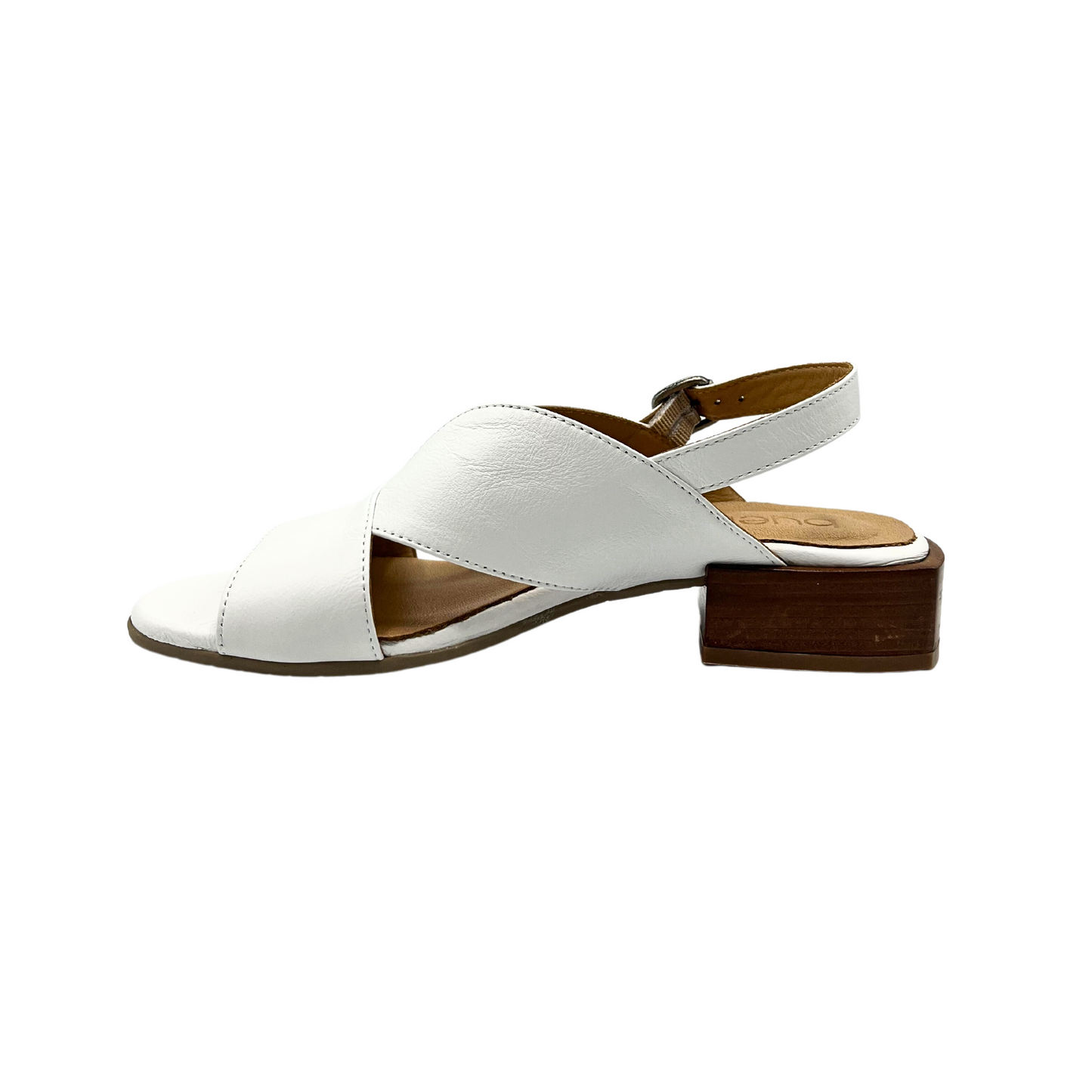 Inside view of white sandal.  Low block heel, open on both sides through the mid foot, adjustable strap at heel