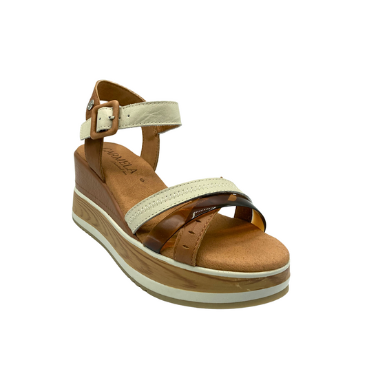 Angled front view of platform sandal in shades of taupe, tan and cream