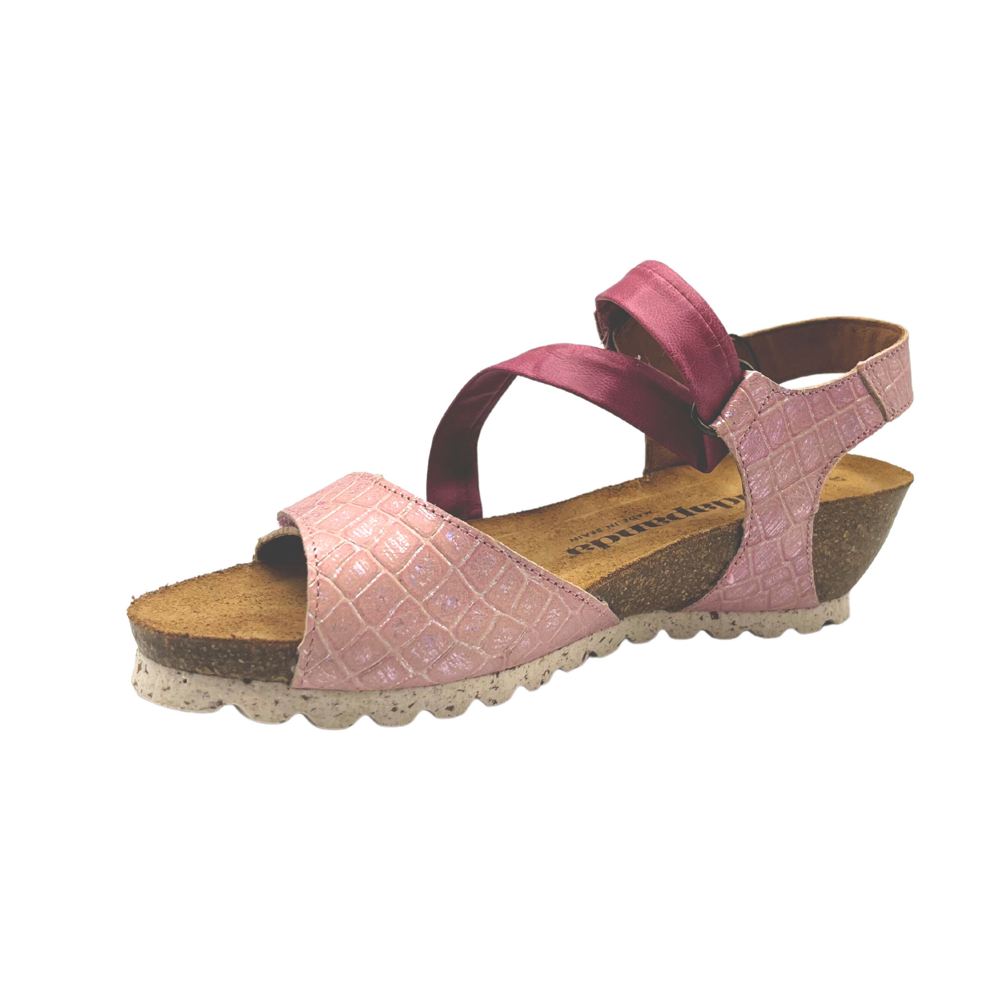 Anlged inside view of a pink leather sandal.  Leather has a croco pattern.