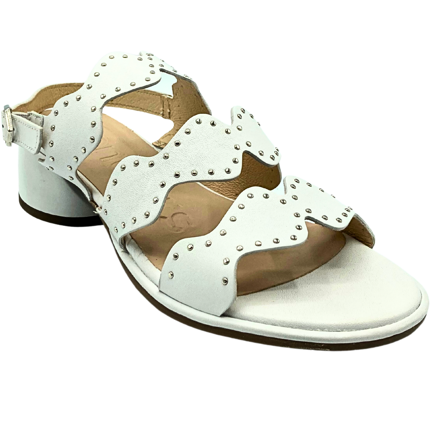 Angled front view of a summer sandal in white leather with tiny silver stud details around the scalloped straps