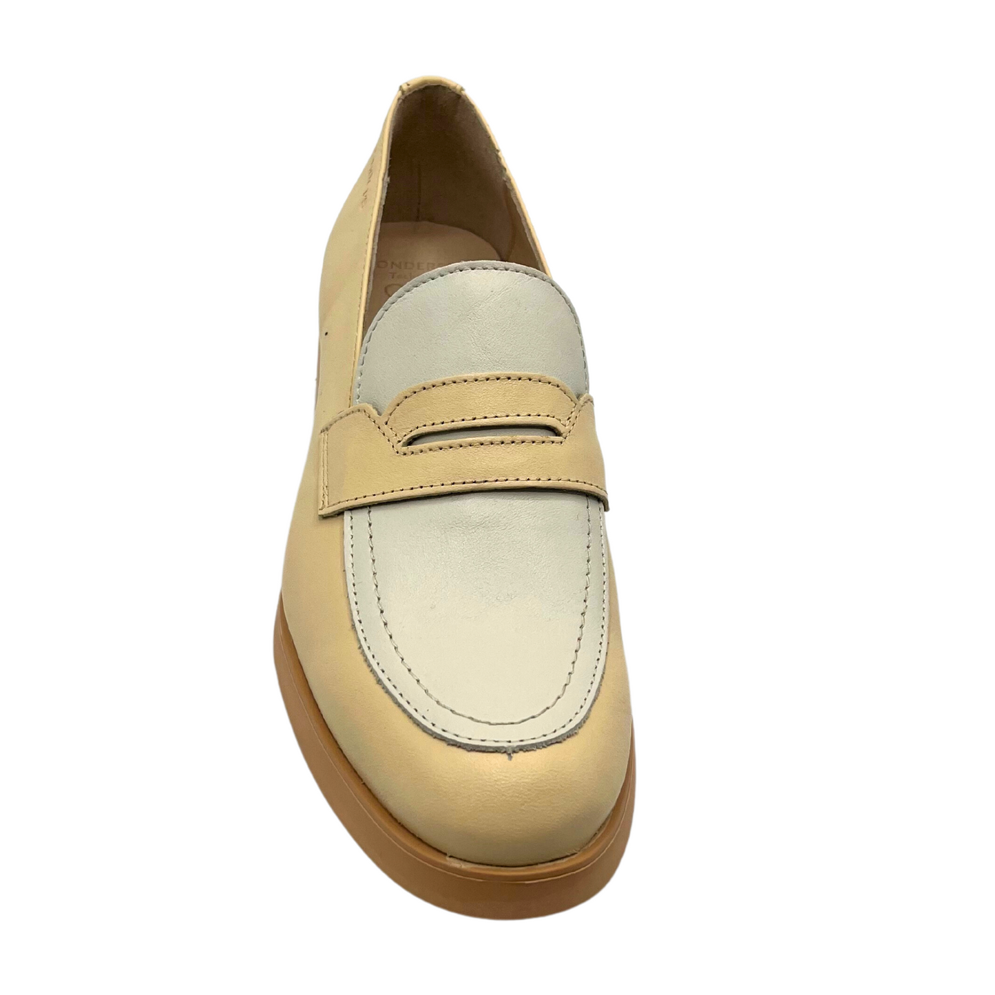 Top down view of a slip on loafer in a two-tone leather.  Natural leather around the body of the shoe and a light taupe over the taupe