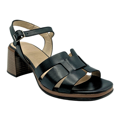 Angled side view of an open toe sandal.  Good coverage over forefoot.  Both ankel and heel strap
