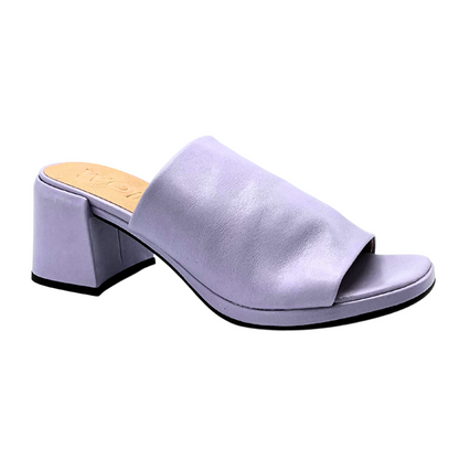 Outside view of a leather mule in a lavender color.  Heel is wrapped in same leather