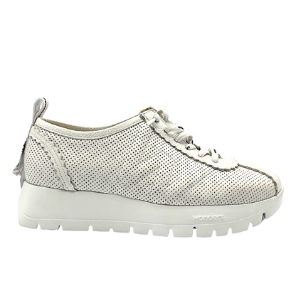 Outside view of white fashion sneaker.  Details include laser cut outs in the leather