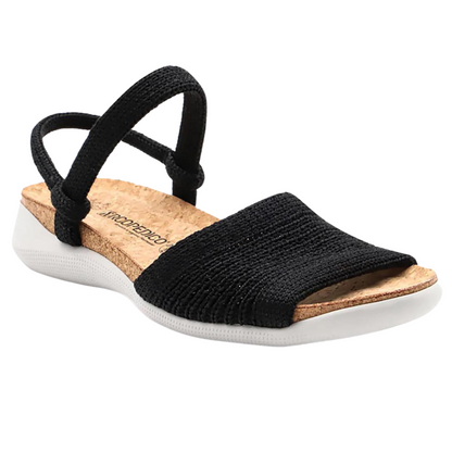 A black knitted sandal with toe, ankle, and heel bands is attached to a cork and white perforated sole.