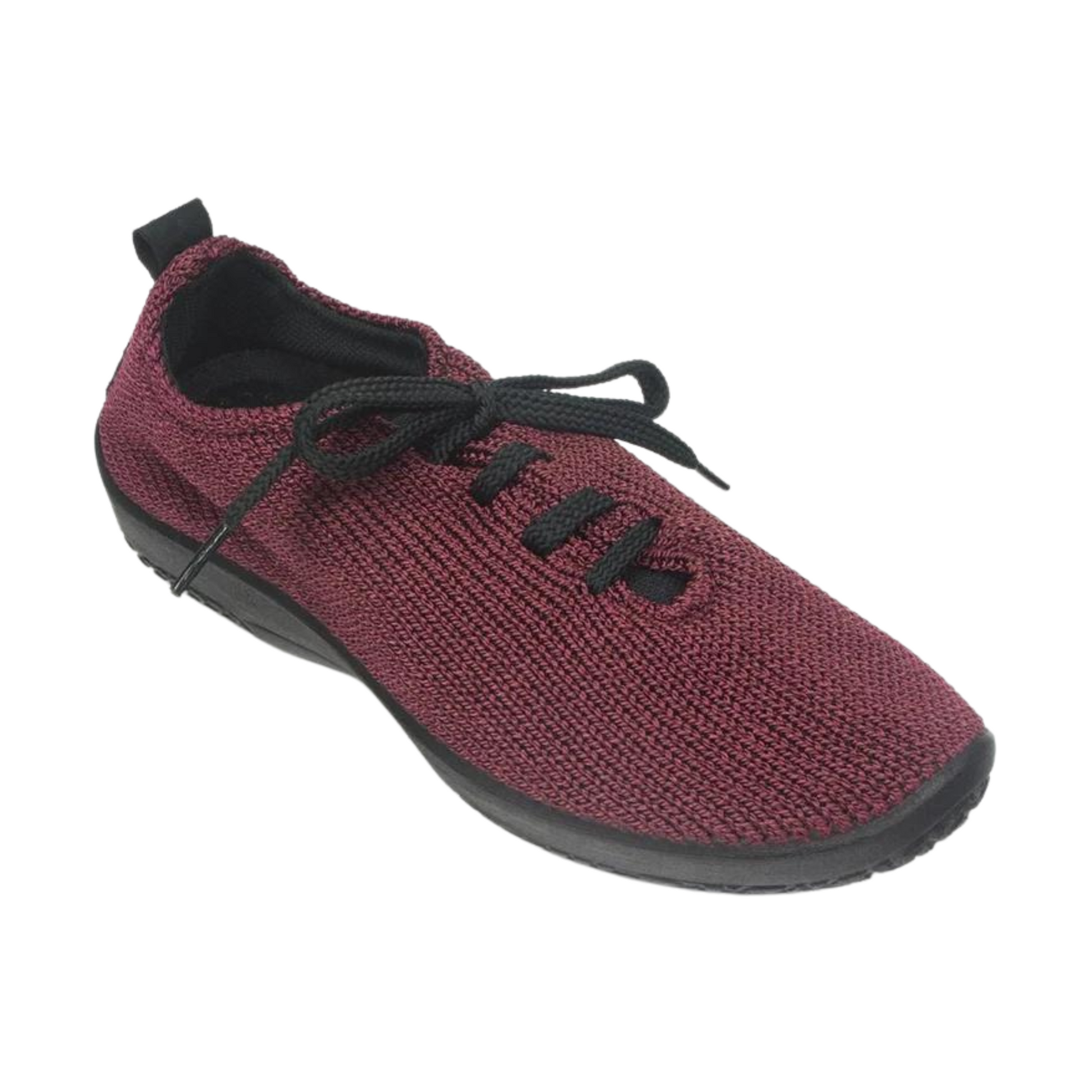 A right angle view of a burgundy coloured knit shoe with black laces.