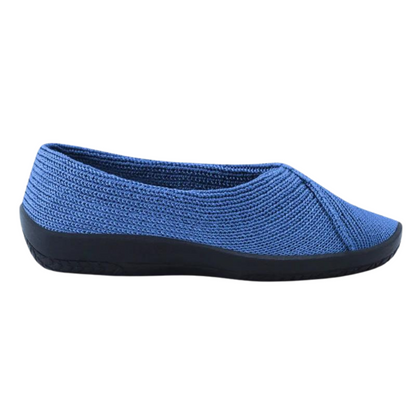A blue knitted shoe is pictured in profile with dark navy or black thick sole.