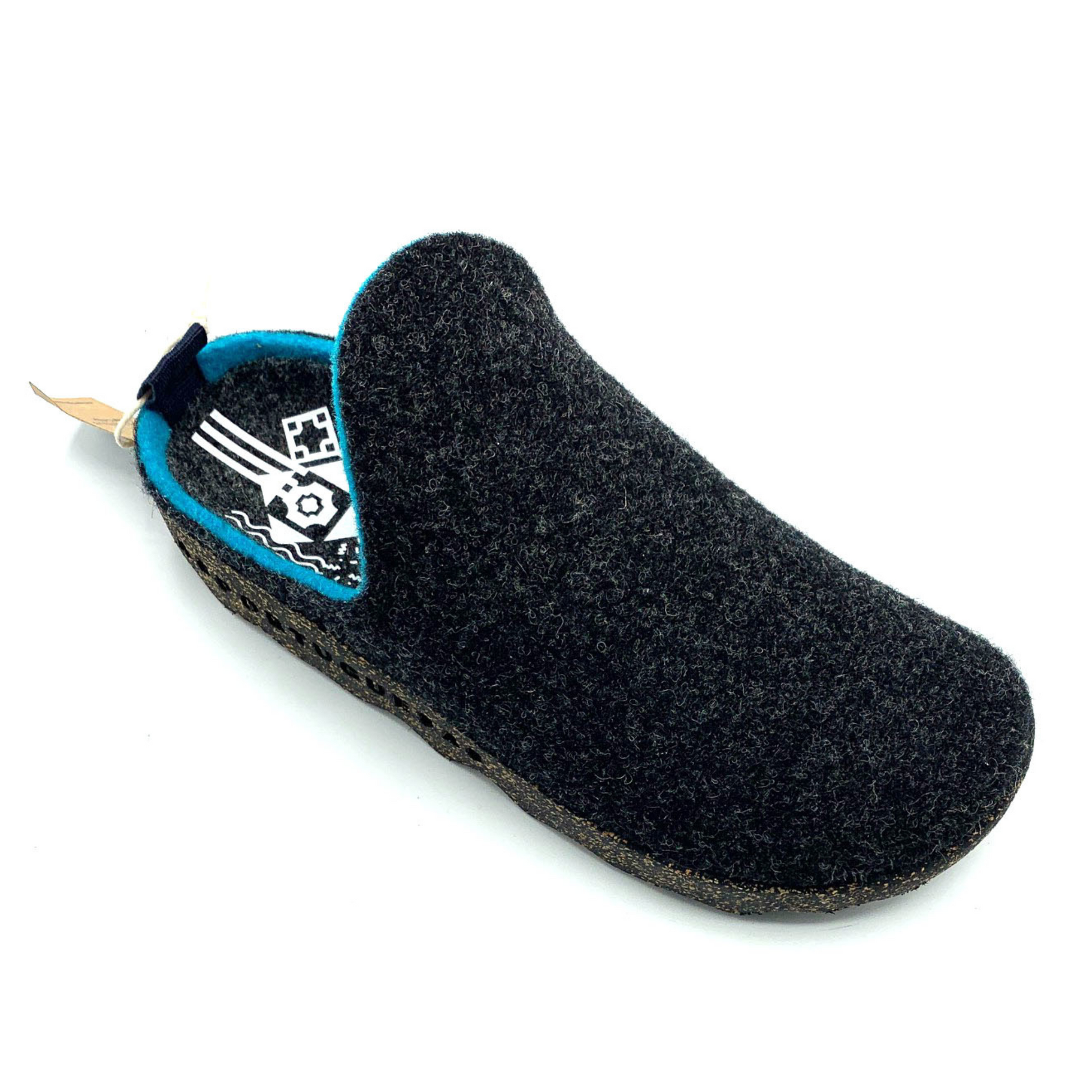 A blackish grey felted shoe with no heel is pictured from a front angle, there is electric blue lining around the opening for the foot and a white geometric pattern on the sole.
