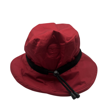 A front view of a red hat with a black drawstring.