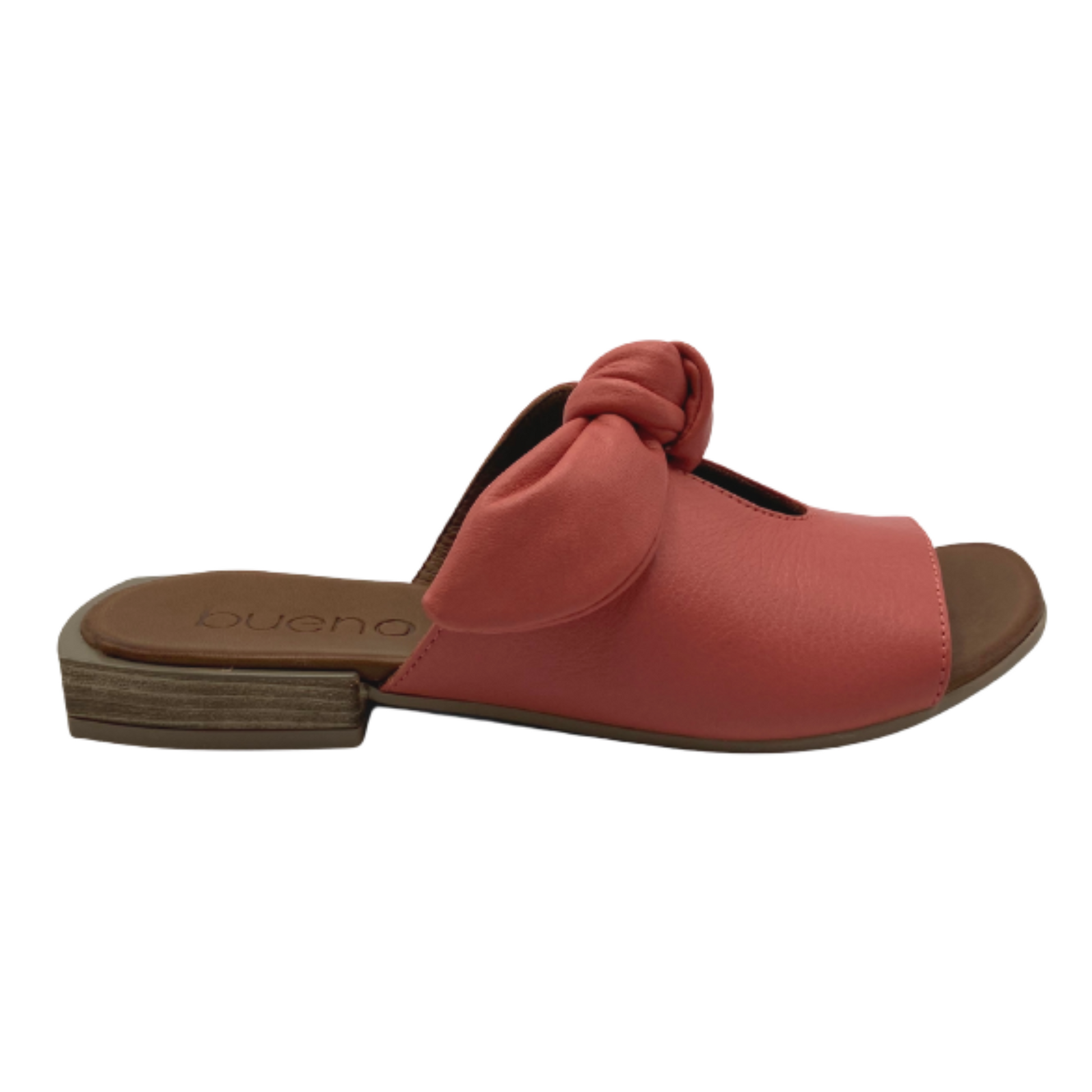 The side of the coral-red-pink sandal is pictured in profile showing a slight heel with block texture.