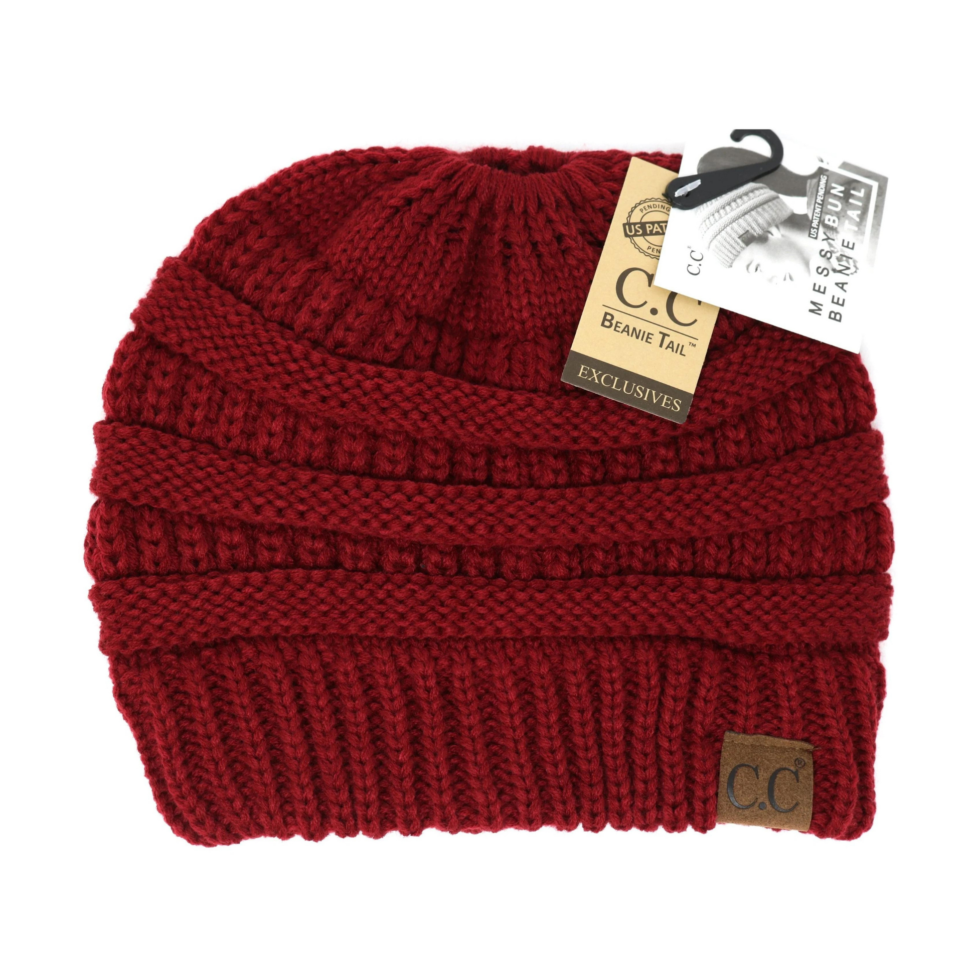 A front view of a burgundy, ribbed knitted beanie with an opening in the top.