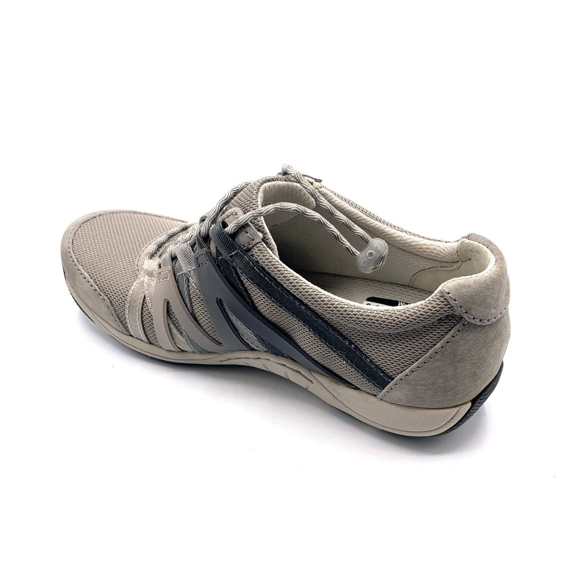 A warm grey sneaker viewed from a left-top angle. The shoe has grey cord-like laces, a mesh top, suede detailing, and an Ombre zig-zagged side pattern.