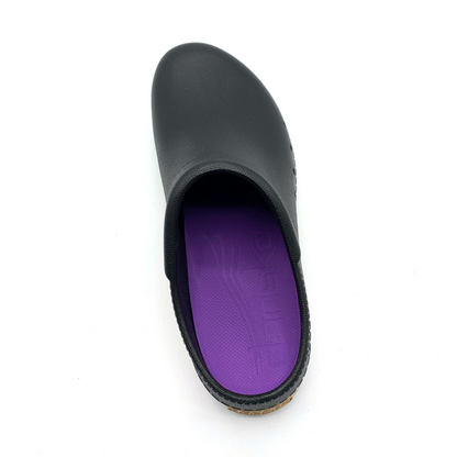 A top view of a black clog with a purple insole.