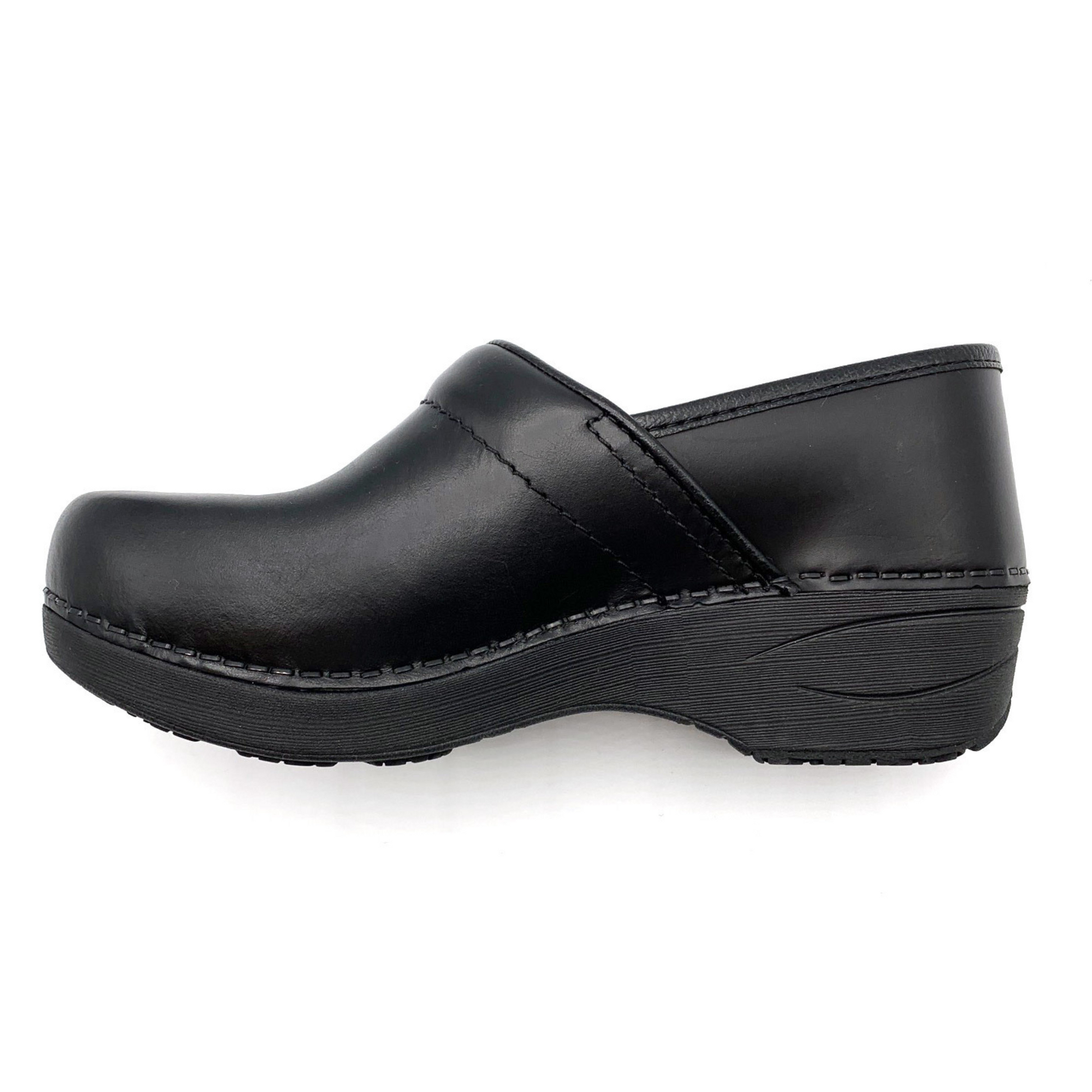 Left side view of the clog showing the soft heel and side stitching.