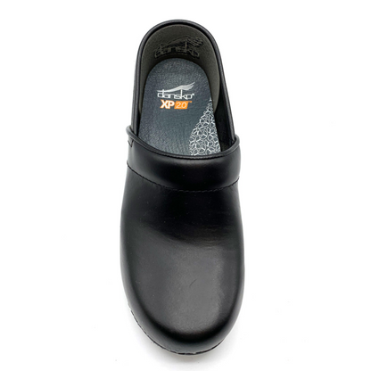 The upper front view of the right clog showing the insoles and the leather on the top of the shoe.