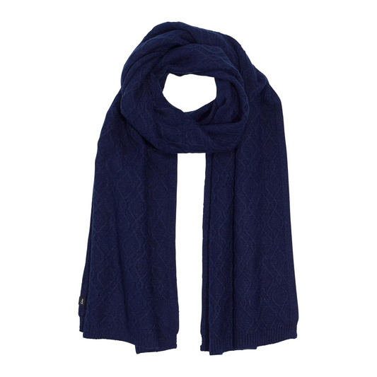 A navy scarf with interweaving cable knit is pictured with a loop in the top and long tails running down.
