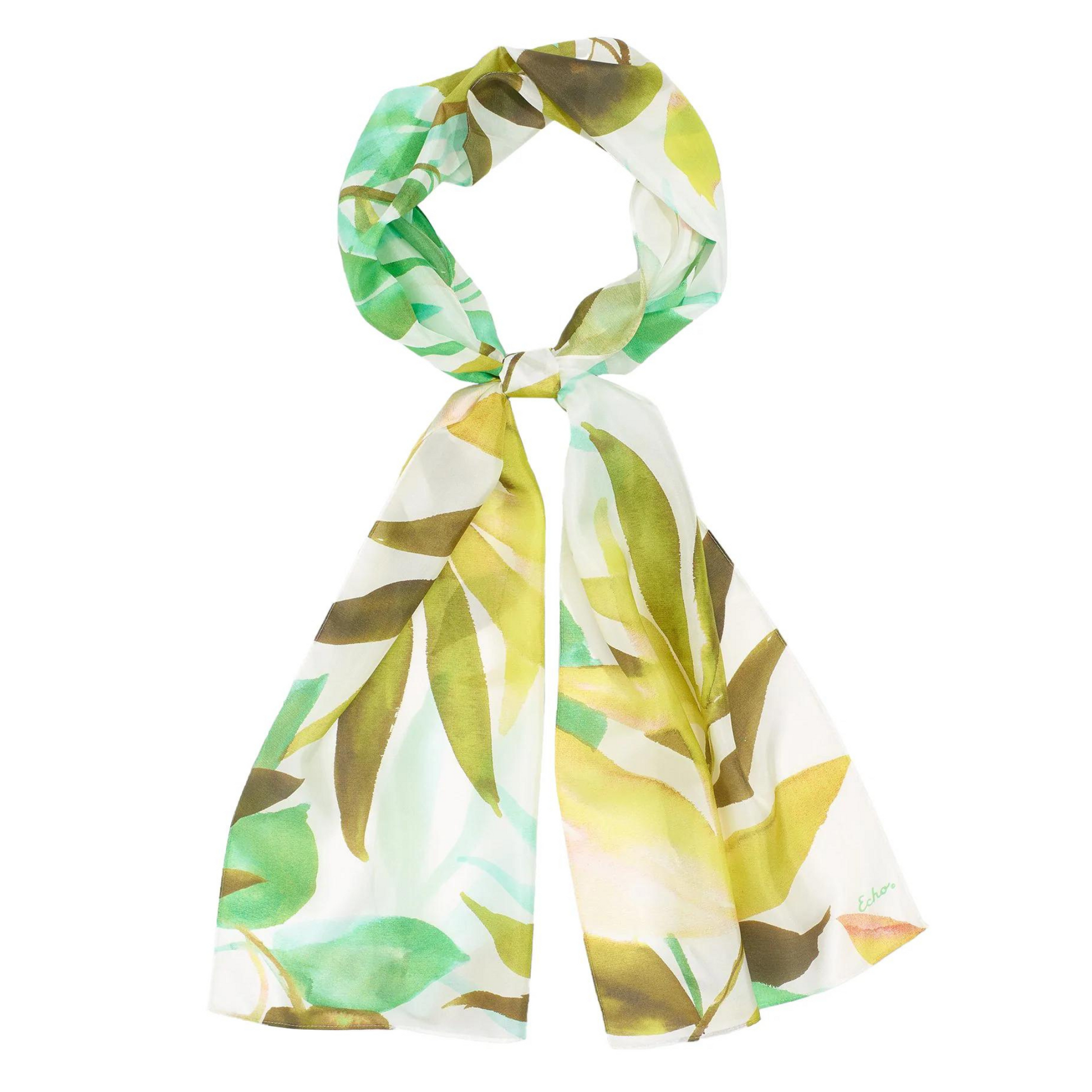 A scarf with watercolour palm leaves in various shades of green on a white background is shown looped around itself.