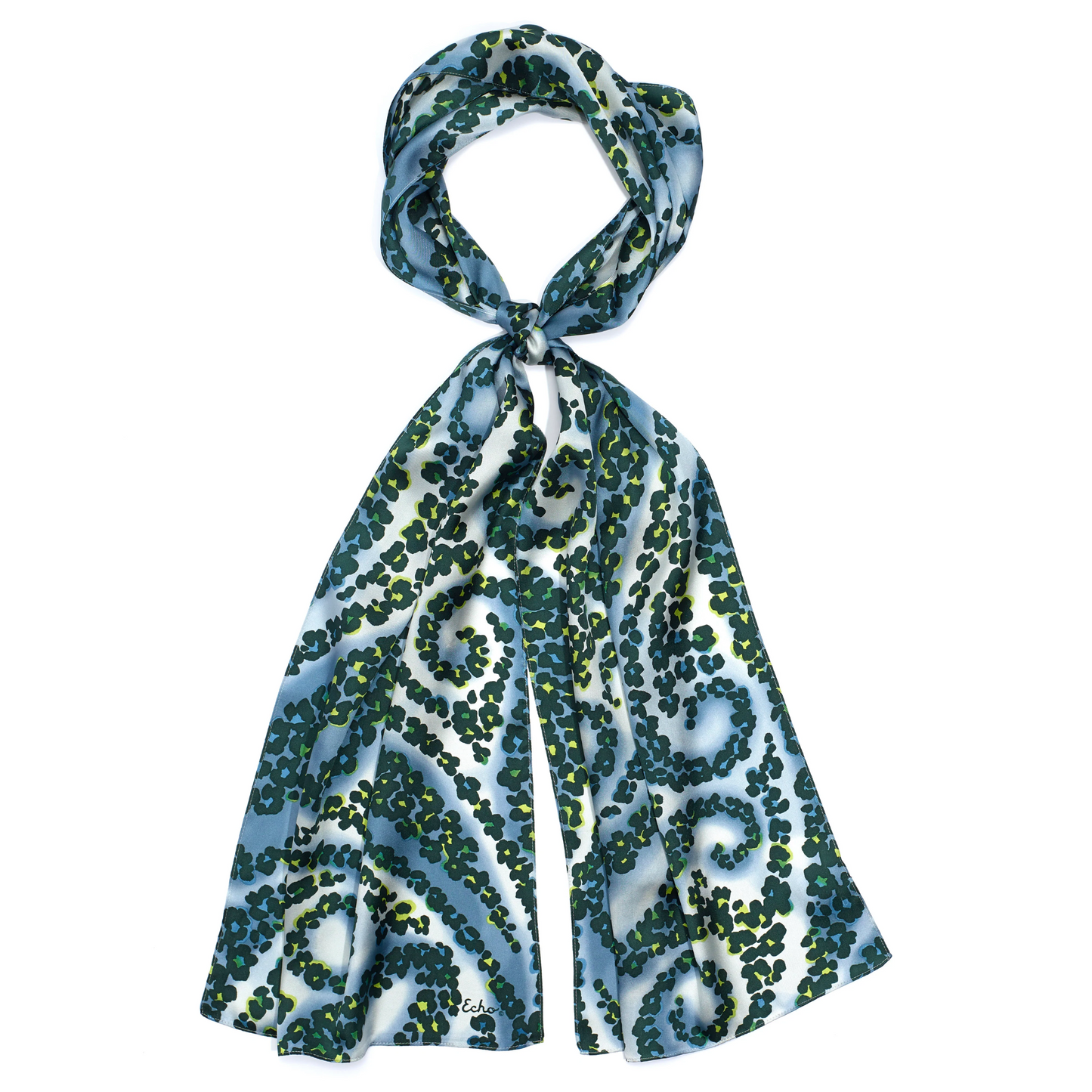 A blue and white coloured scarf is pictured with a tied loop and has green coloured spots that create a swirled pattern.