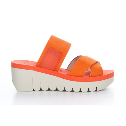 A right side view of a red-orange platform wedged sandal with a white outsole.