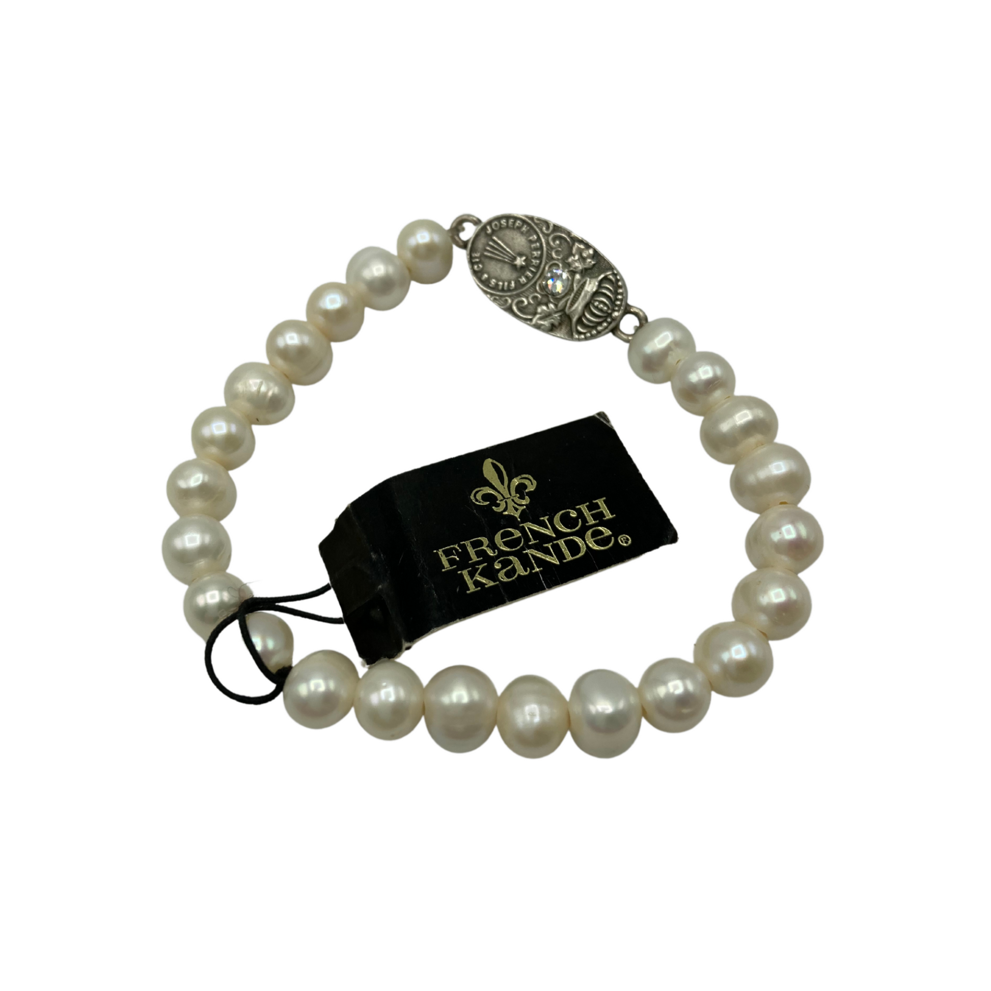 A beaded, pearl bracelet with an engraved silver medallion in the string.