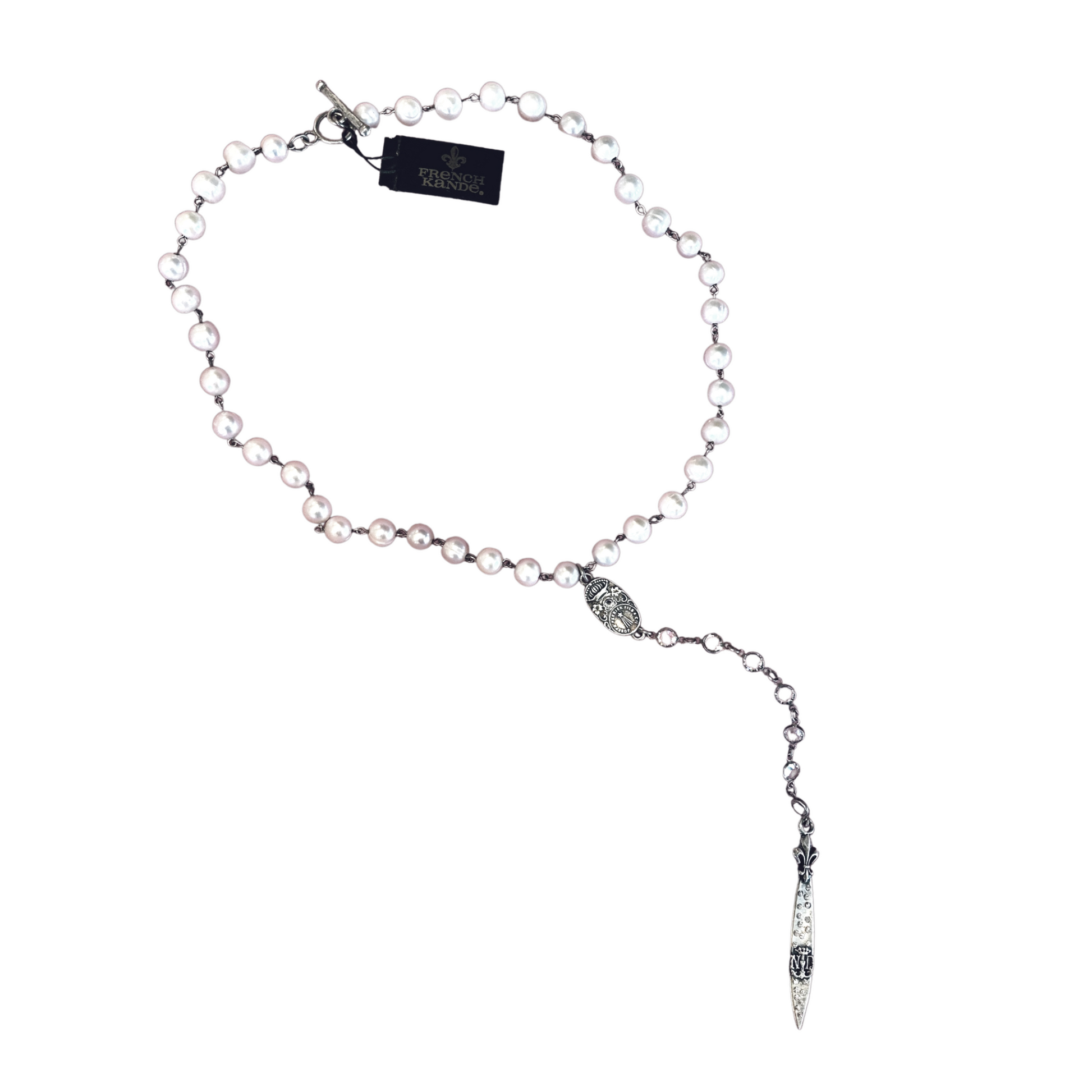 A pearl necklace with a long, silver pendant and a silver chain.