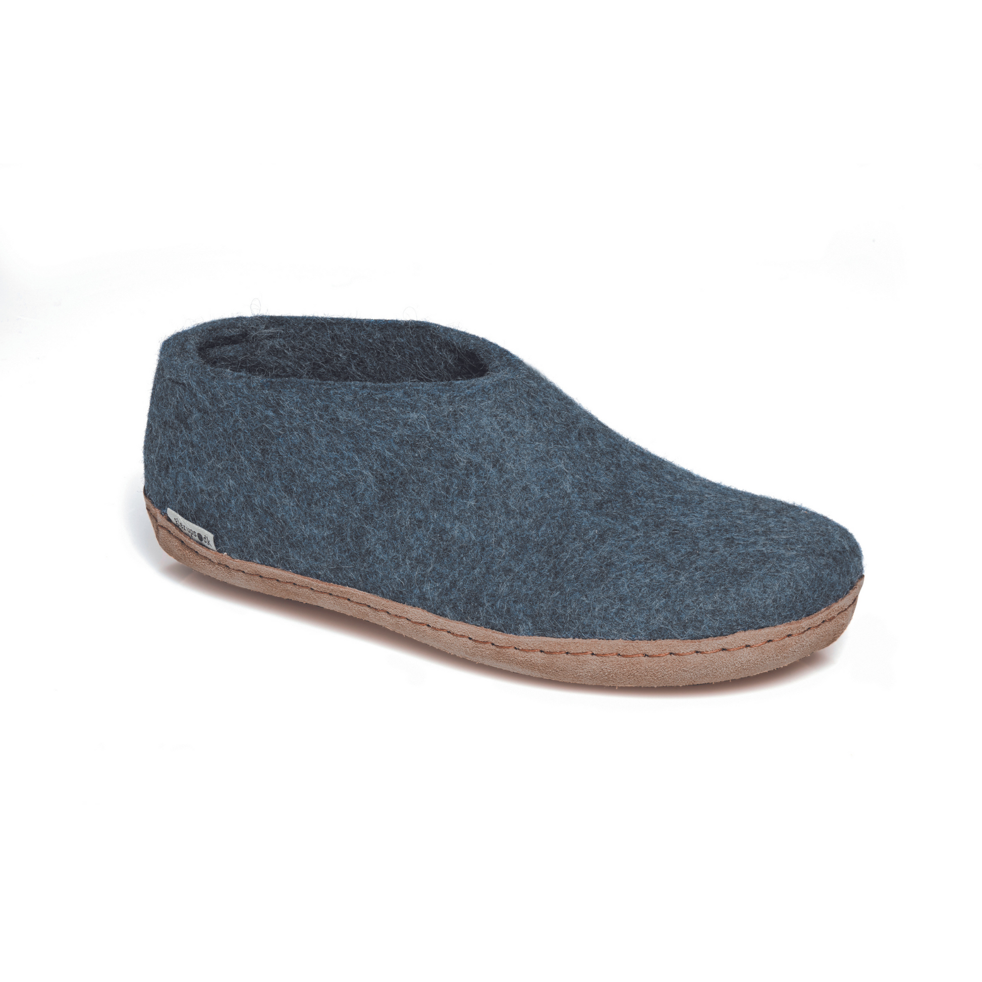 A felted dark demin-blue tall-back slipper pictured at a slight angle, showing part of the top front and side of the slipper. A tan leather sole lines the bottom of the shoe with a row of stitching.