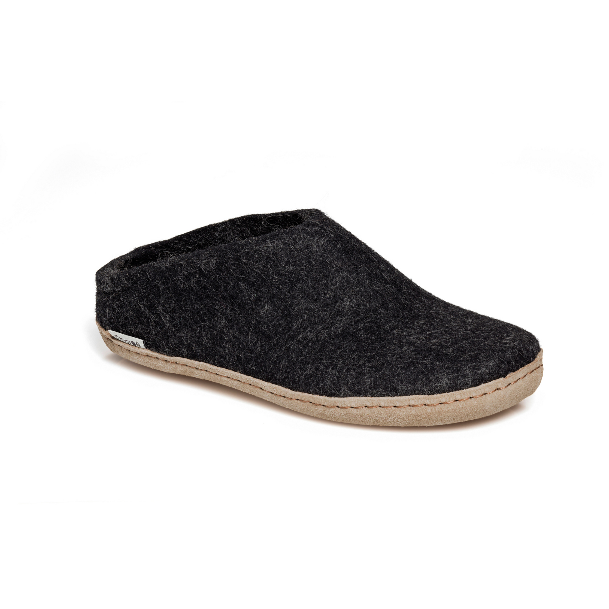 A felted dark grey slipper pictured at a slight angle, showing part of the top front and side of the slipper. A tan leather sole lines the bottom of the shoe with a row of stitching.