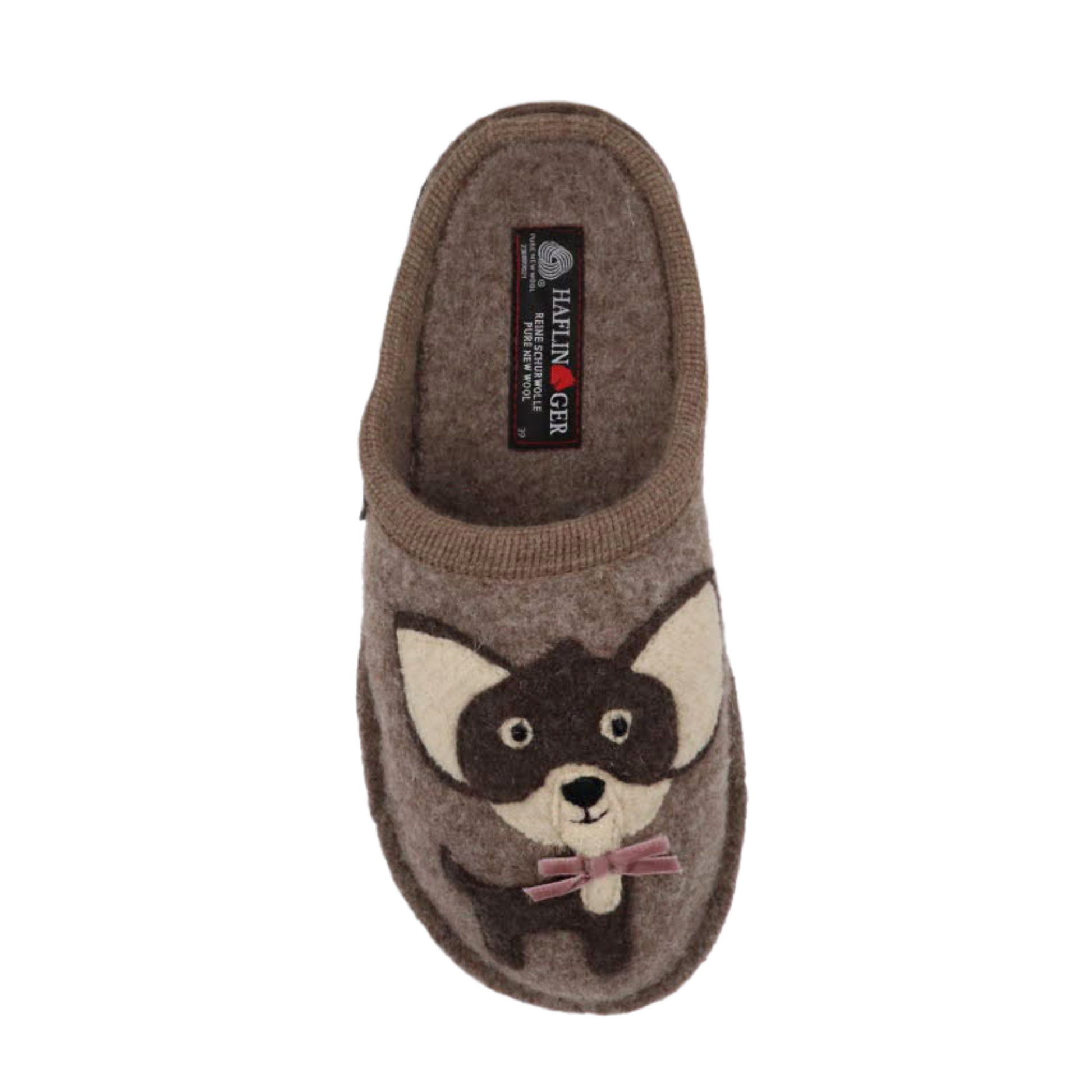 A top view of a tan wool slipper with a chihuahua design.