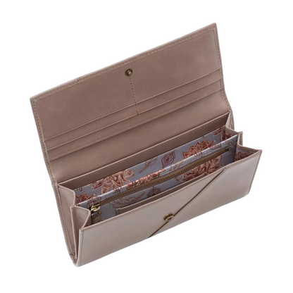 The interior of a warm grey accordion wallet with floral lined interior is pictured at an angle.