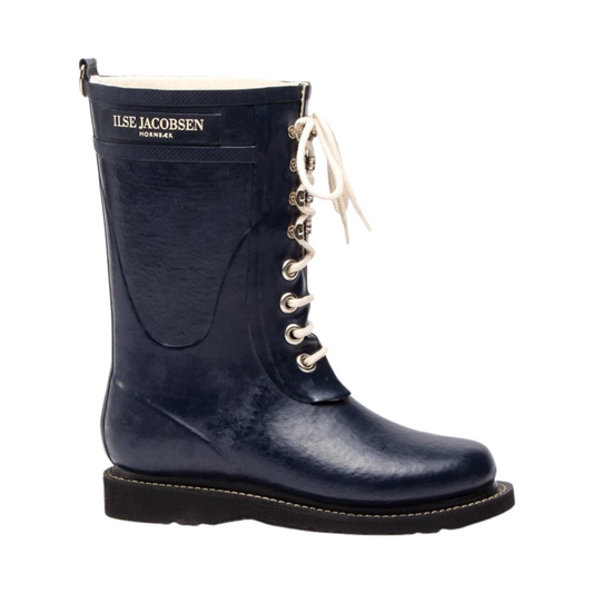 A right side view of a navy rubber boot with white laces.