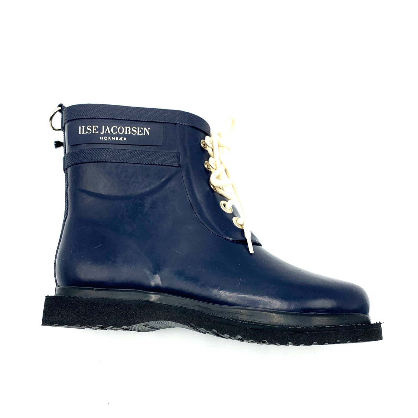 A right side view of a navy rain boot with black and white details.