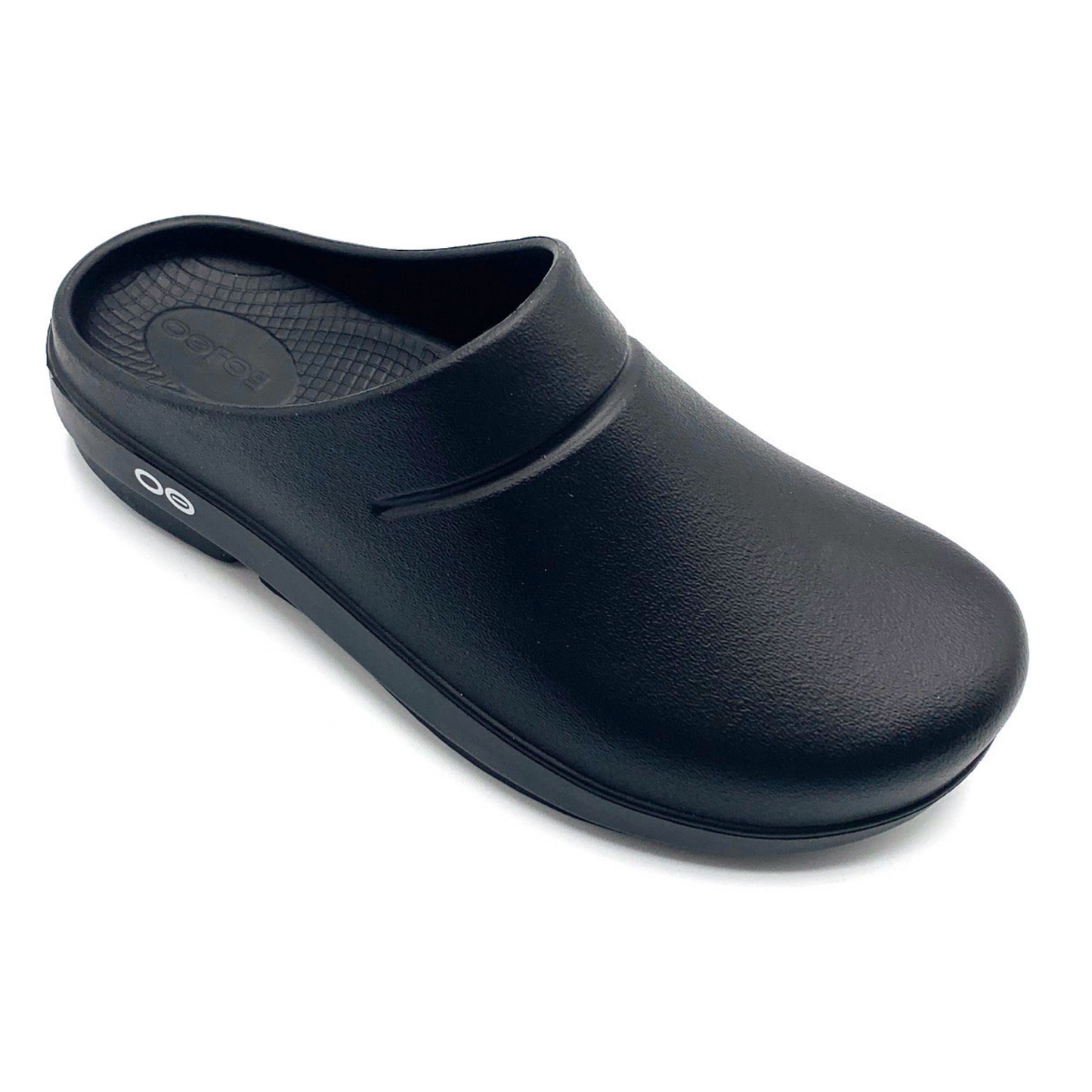 A black lightly textured clog is pictured at an angle.