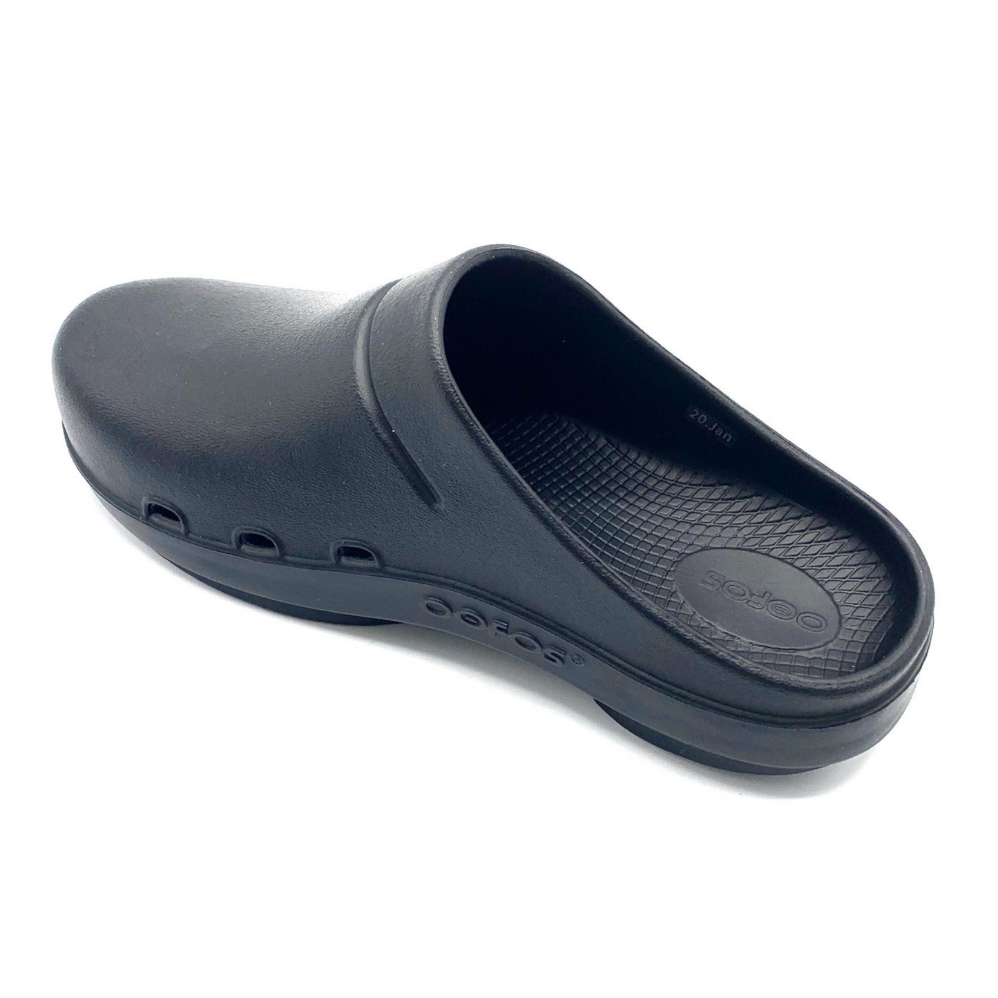 A black clog is pictured at a back angle showing the waffle textured footbed and small side foot cut outs.