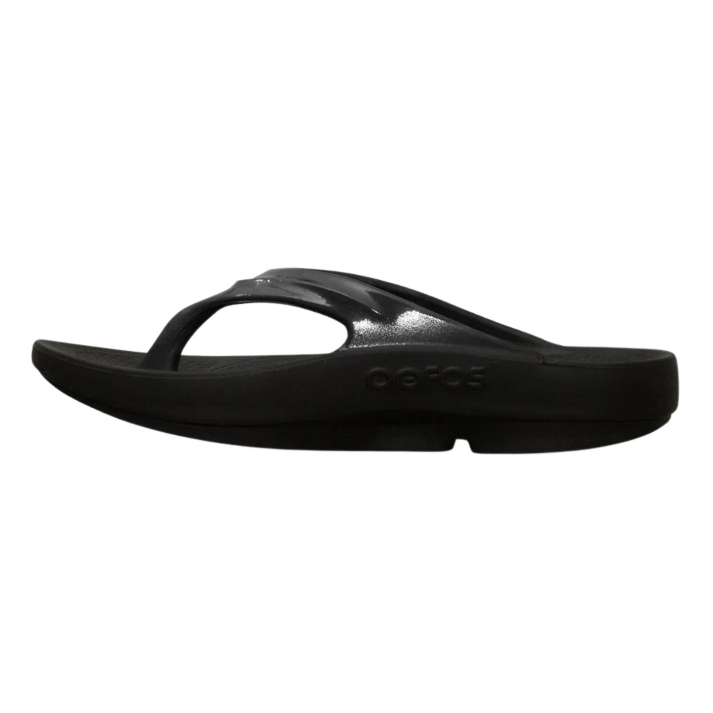 A left angle view of a black foam sandal with a single between-toe strap and grippy sole.