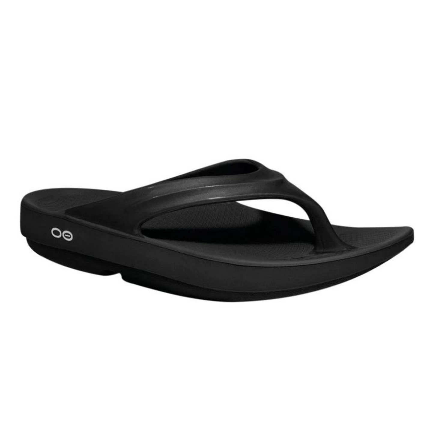A right angle view of a black foam sandal with a single between-toe strap and grippy sole.
