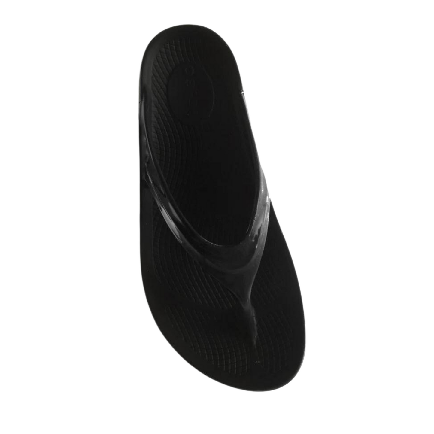 A top view of a black foam sandal with a single between-toe strap and grippy sole.