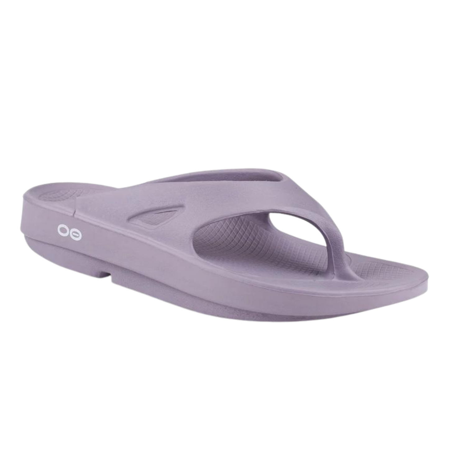 A right angle view of a light purple foam sandal with a between-toe strap.