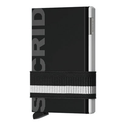 A black and silver metallic wallet with "secrid" written vertically along the black metal piece. and a black and white elastic band