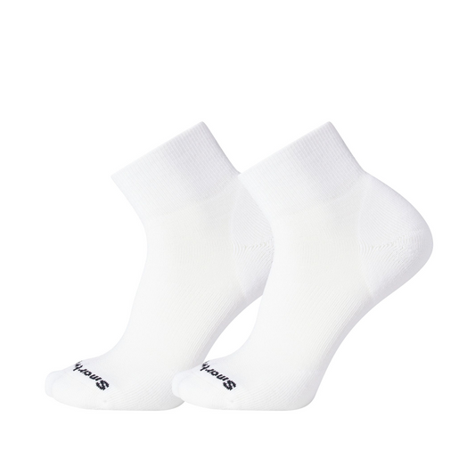 A side view of two white socks with a black Smartwool logo.