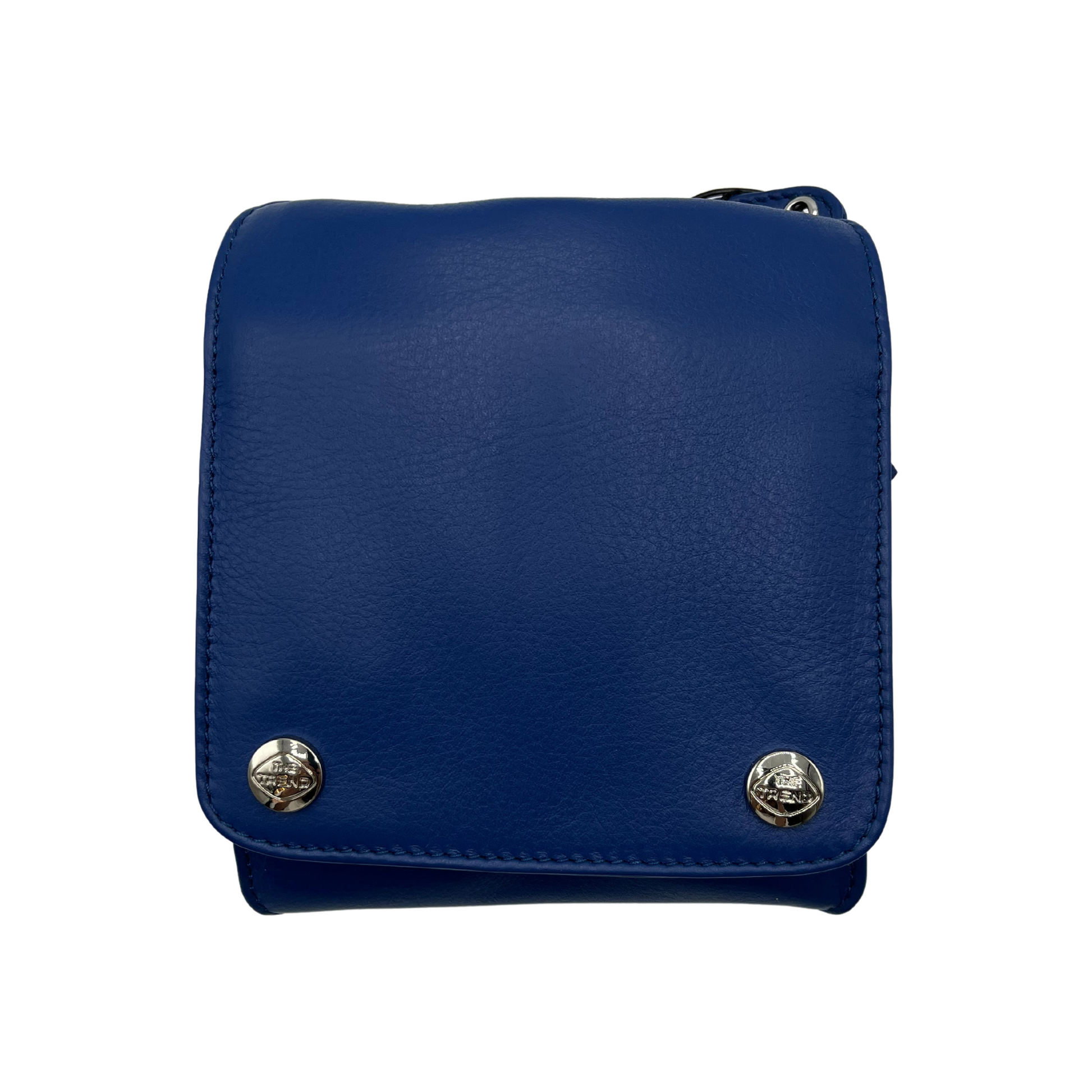 The front of a rich blue leather bag, with a square face and two shiny silver metal buttons, each bearing "The Trend" logo.