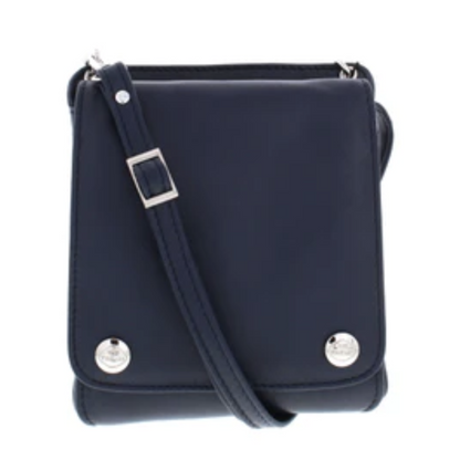 The front of a navy blue leather bag, with a square face and two shiny silver metal buttons, each bearing "The Trend" logo.