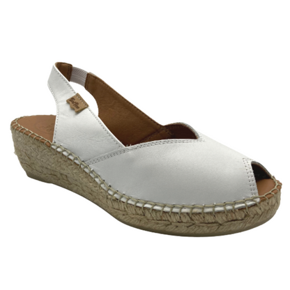 Angled front view of a whte espadrille sandal with a peep toe opening and heel strap.  Shown in white