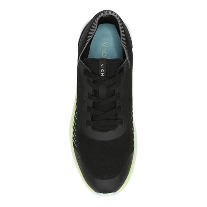 A top view of a black sneaker with lime details and a blue insole.