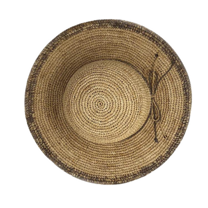 The top of the hat is pictured showing the tan weave, a mixed tan and warm grey string trim around the brim, and a ombré grey edge on the brim.