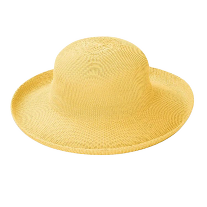 Light yellow weaved hat with soft curvature and rolled in brim.